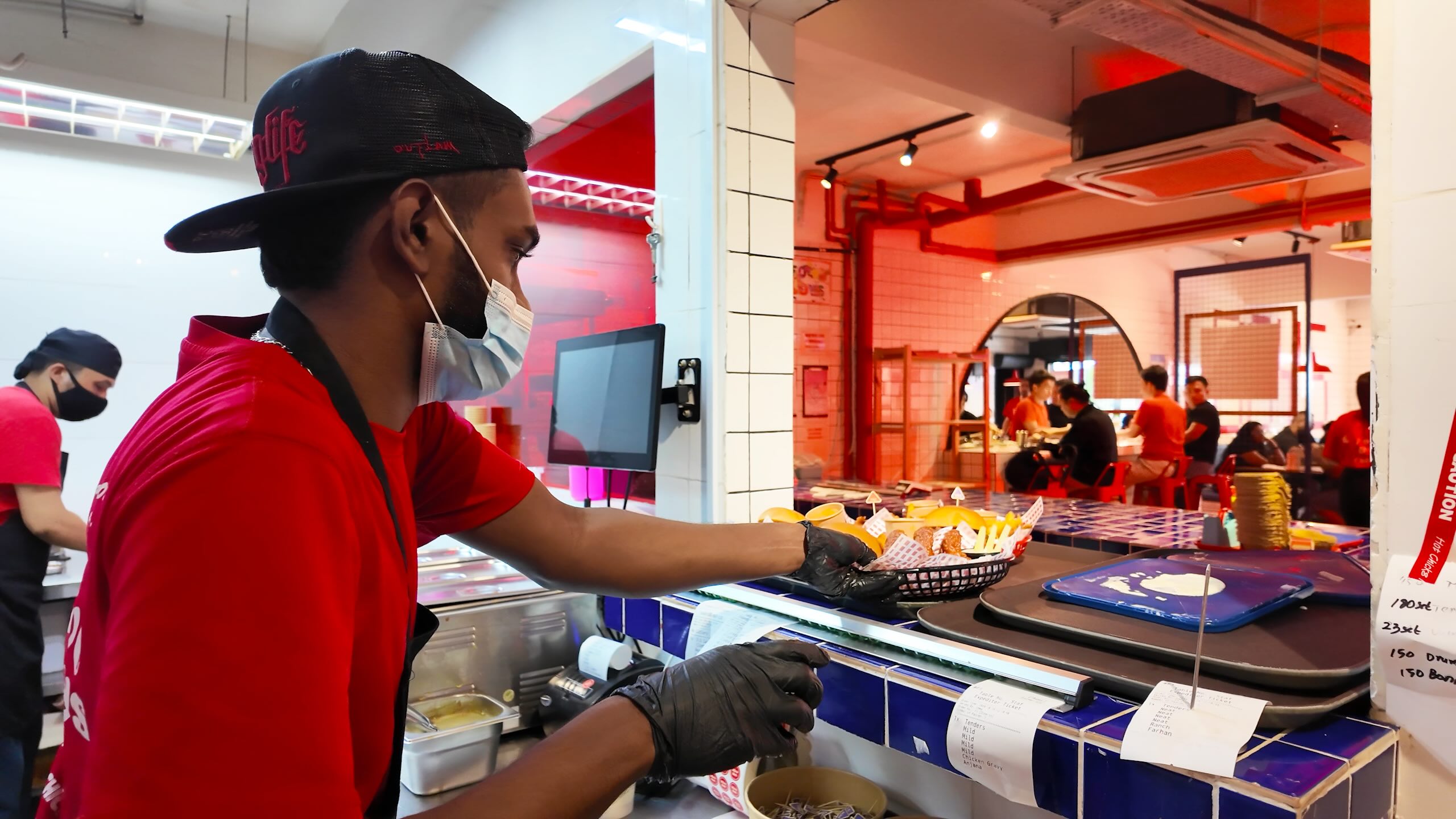 fowlboys staff working in kitchen with pos