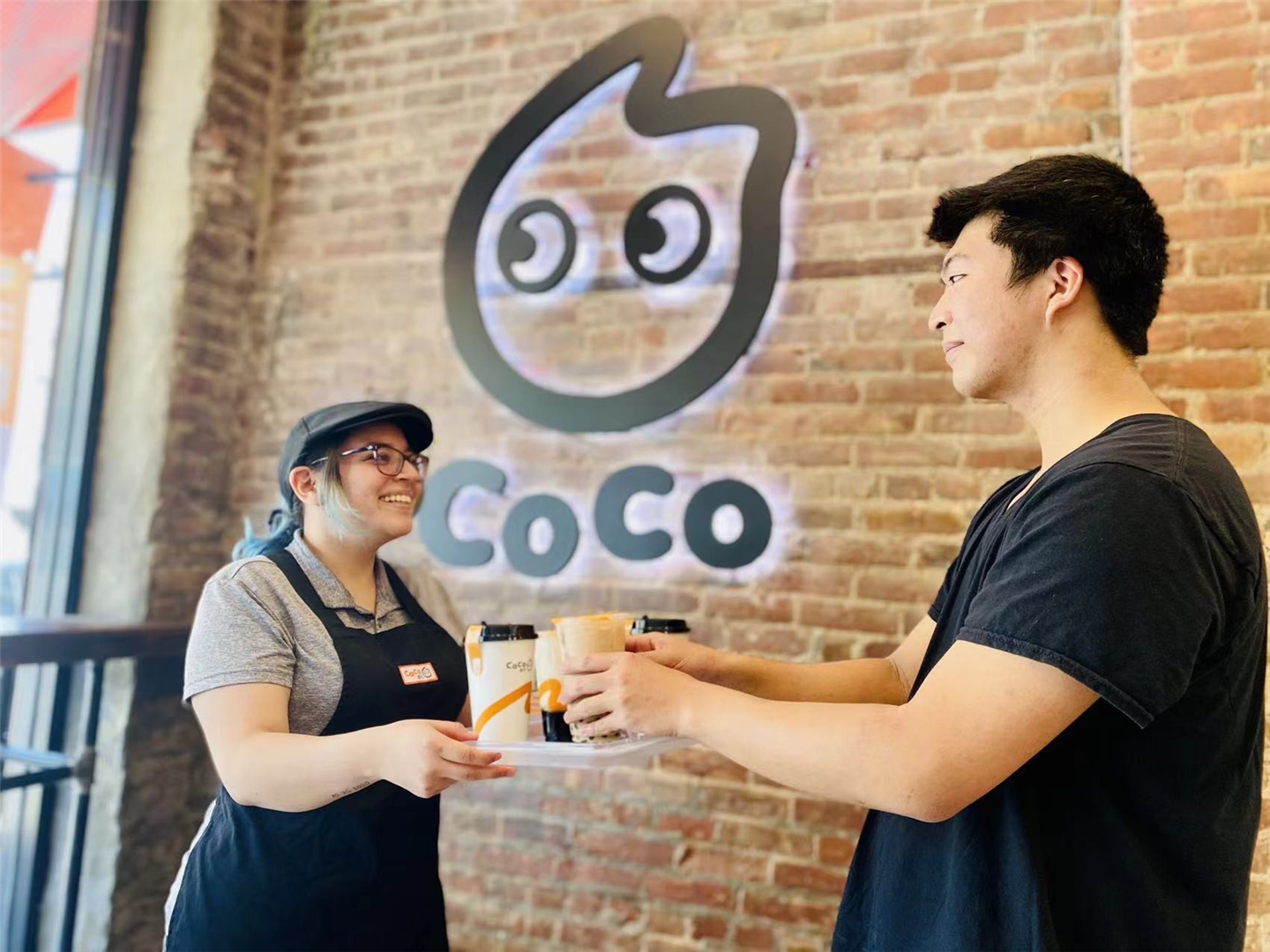 staff of Coco Fresh Tea is serving customer