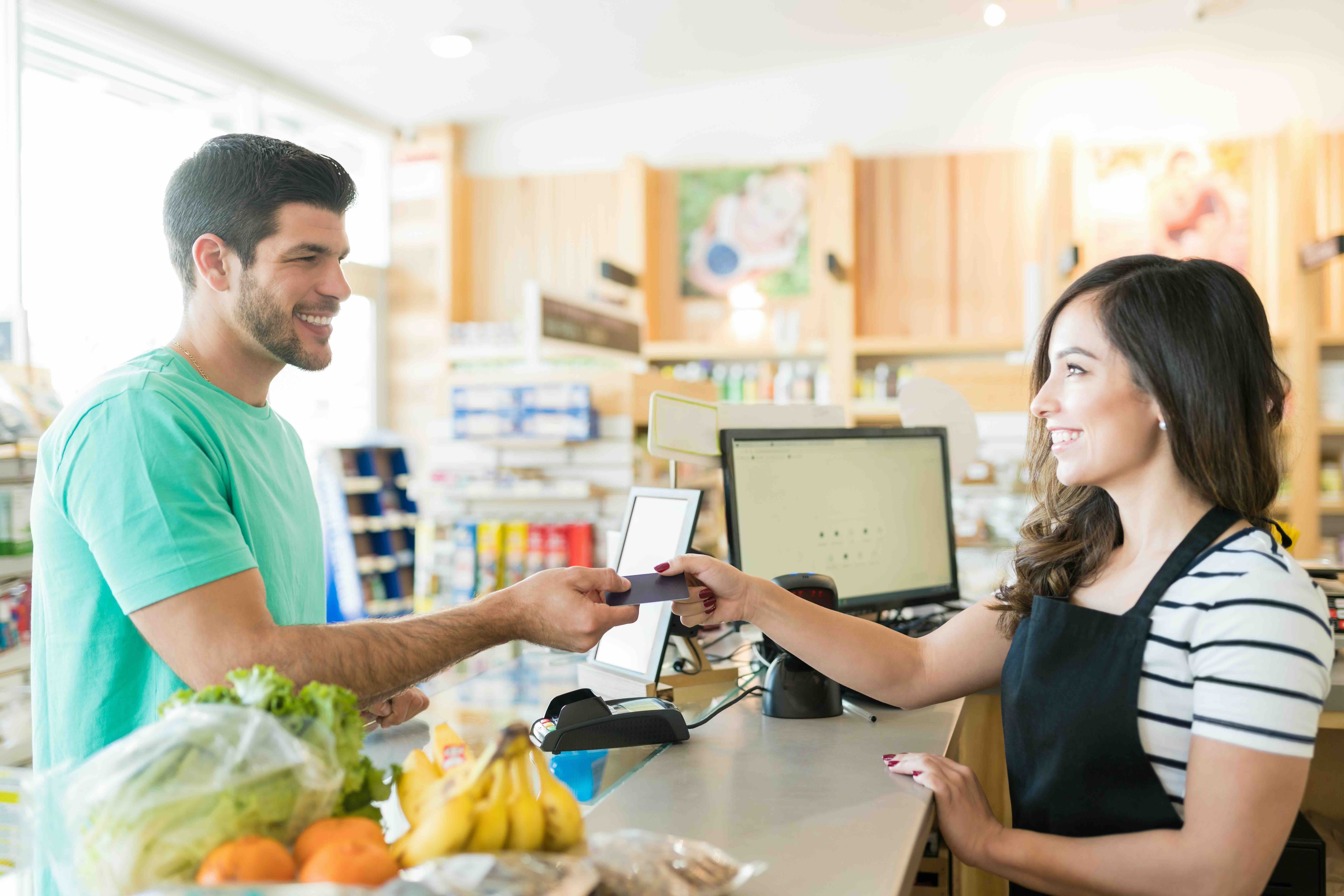 asian customer paying at cashier