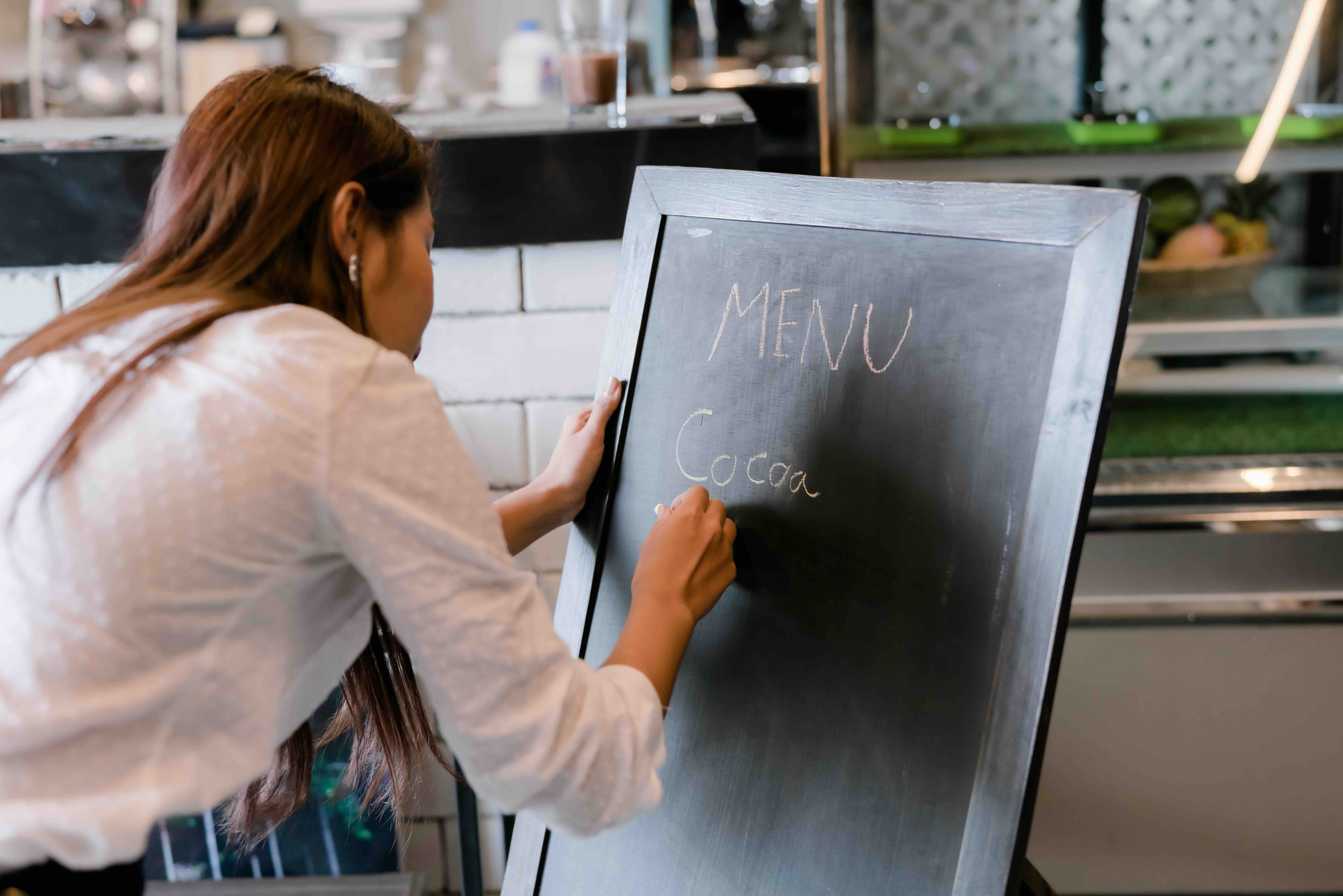 female cafe owner preparing a marketing event