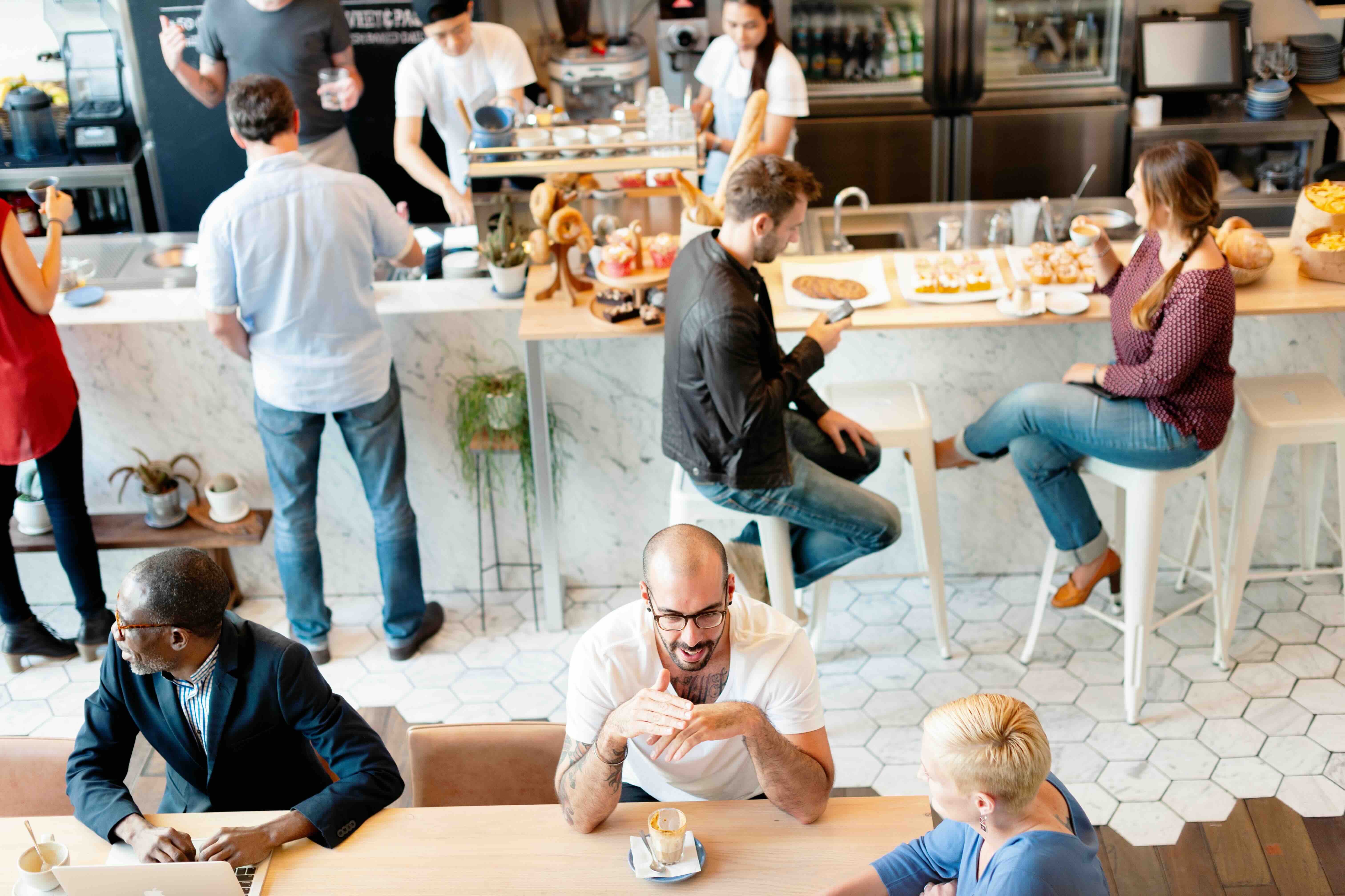 busy cafe with customers waiting