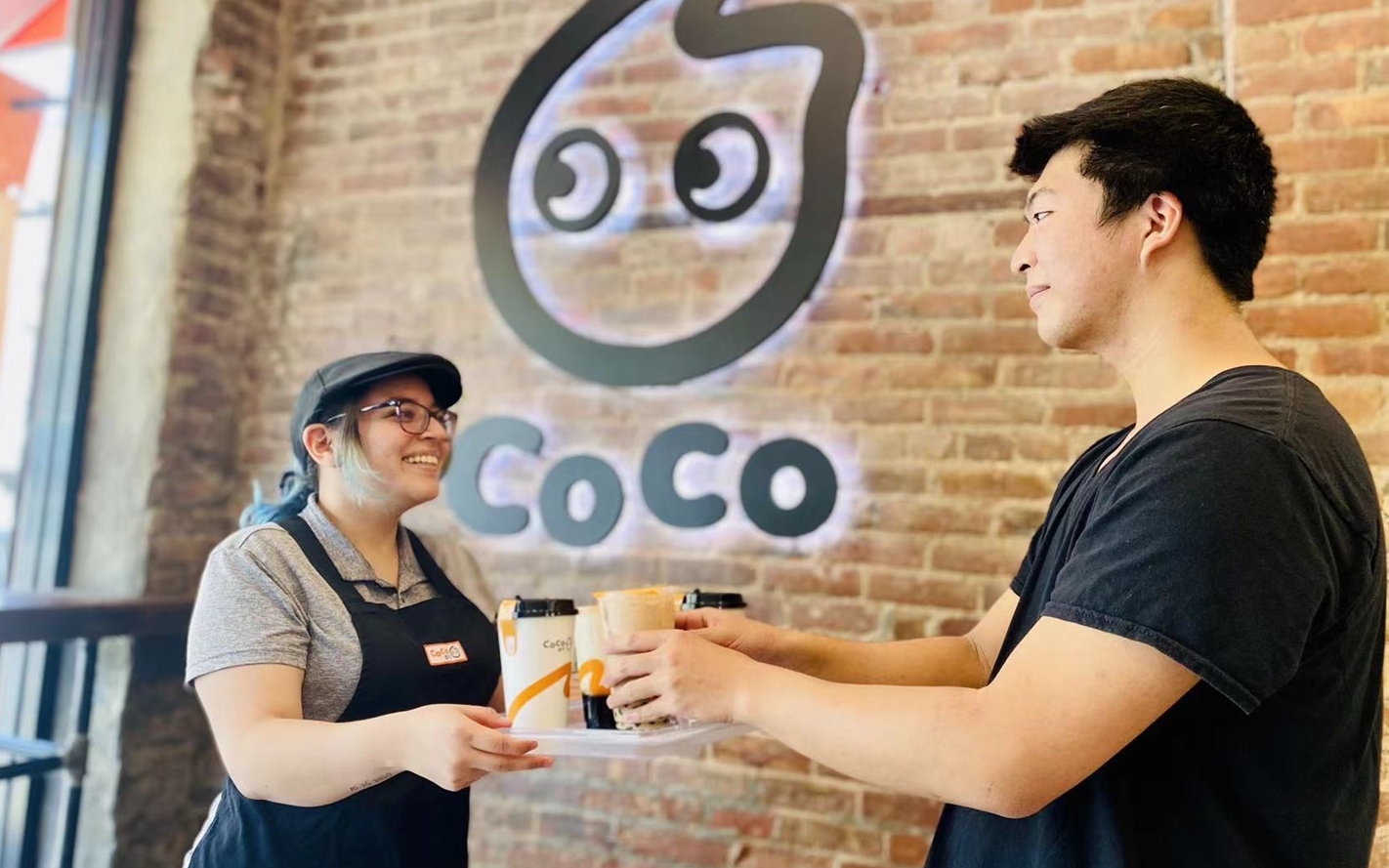 coco fresh tea staff serving customer